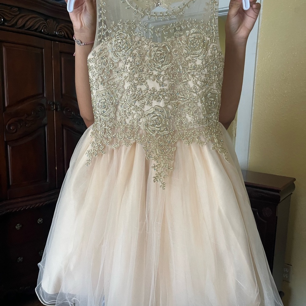 Girl’s gold dress size 10